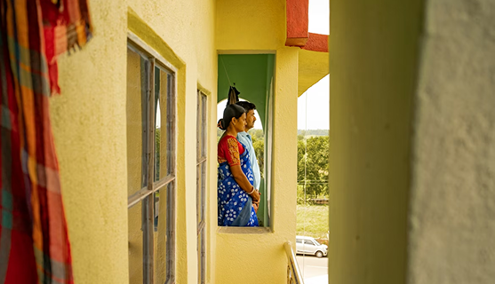 Person standing in a doorway in a developing country